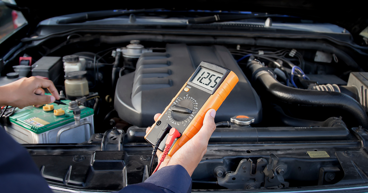technician-checking-electrical-system-car
